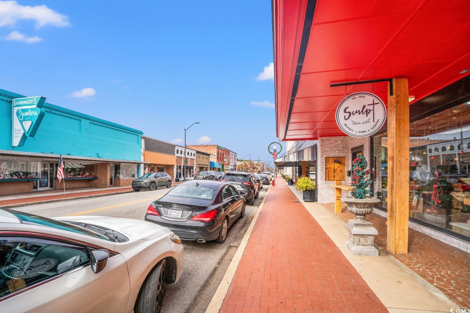 222 East Wine Street Mullins, SC 29574 - Photo 38 of 40 View of asphalt street with sidewalks, street lights, and curbs