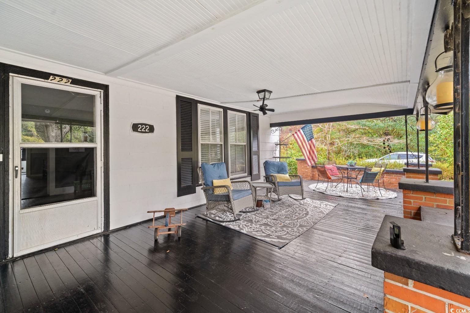 222 East Wine Street Mullins, SC 29574 - Photo 5 of 40 Porch with outdoor dining area