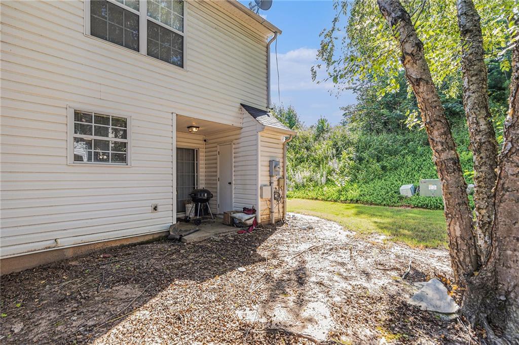 6536 Arbor Gate Drive Southwest, Unit 2 Mableton, GA 30126 - Photo 27 of 27 a view of a house with backyard and a tree