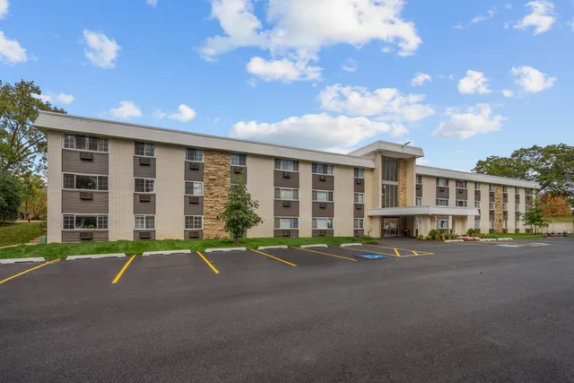 a front view of a building with a street