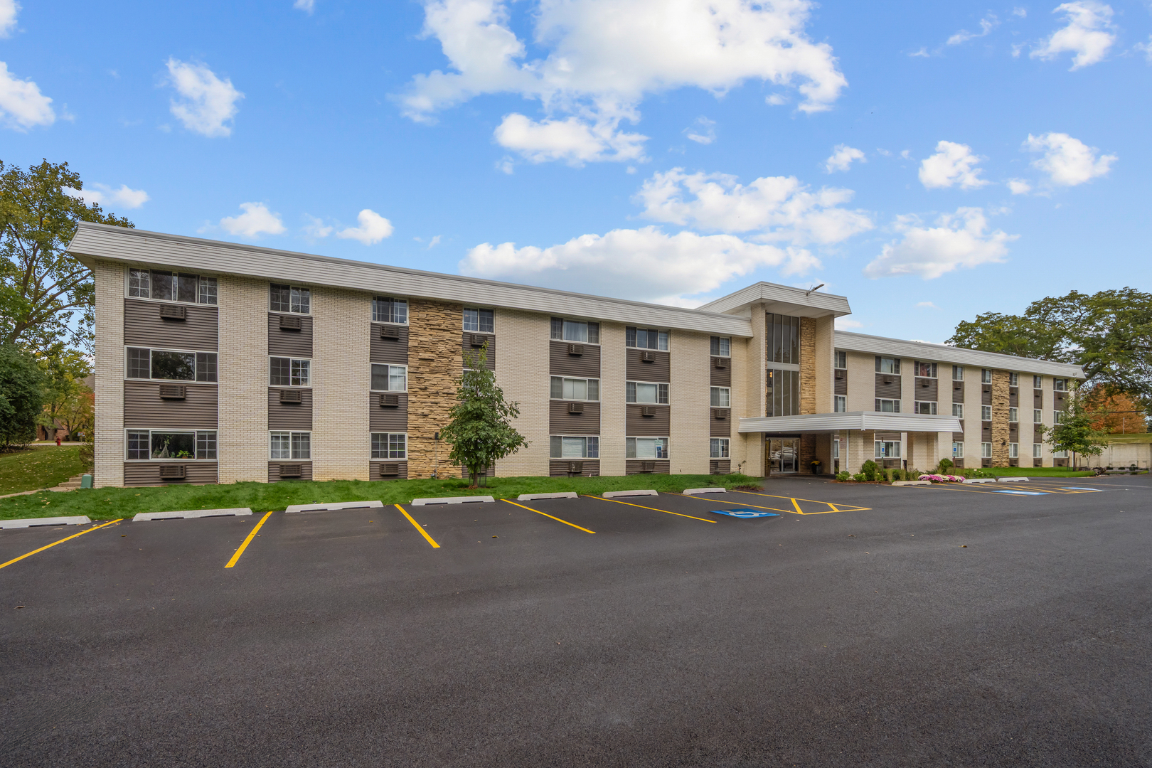 a front view of a building with a street
