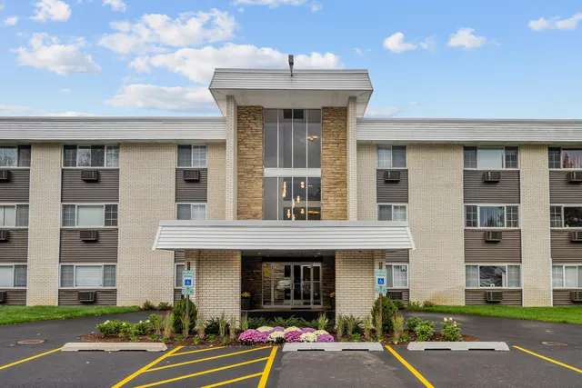 a front view of a building with garden