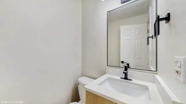 a bathroom with a sink and mirror