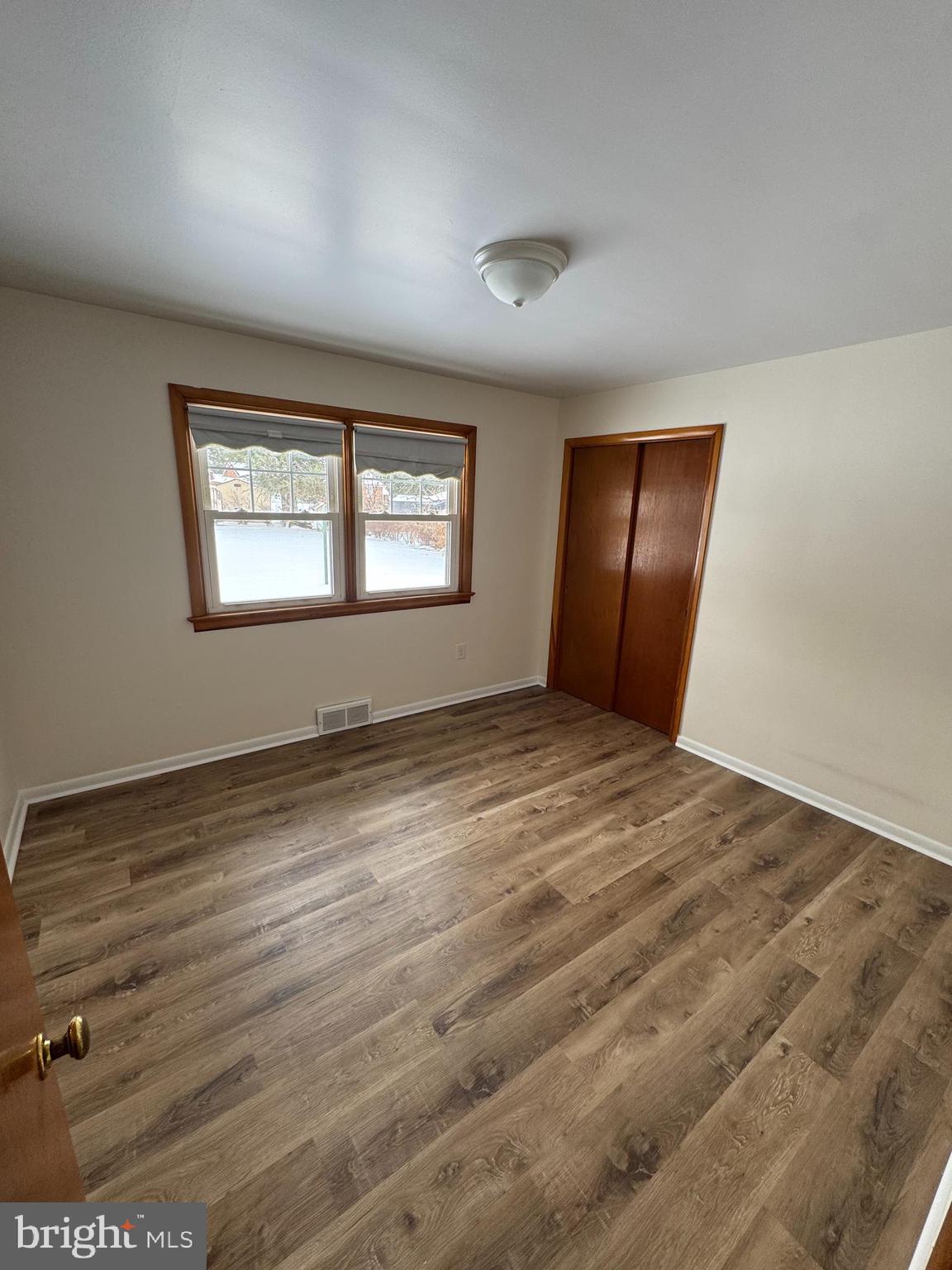 3510 Carlisle Road Dover, PA 17315 - Photo 18 of 32 an empty room with wooden floor and windows