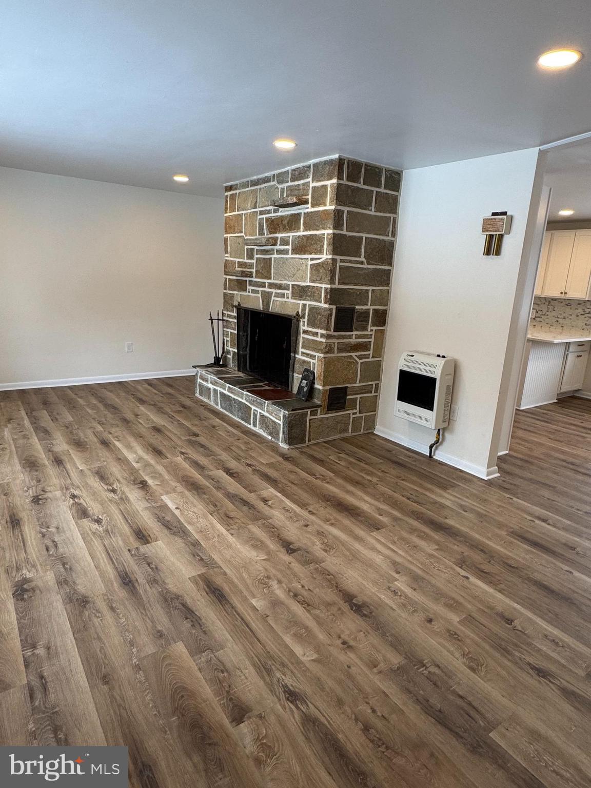 3510 Carlisle Road Dover, PA 17315 - Photo 5 of 32 a view of empty room with wooden floor and fireplace
