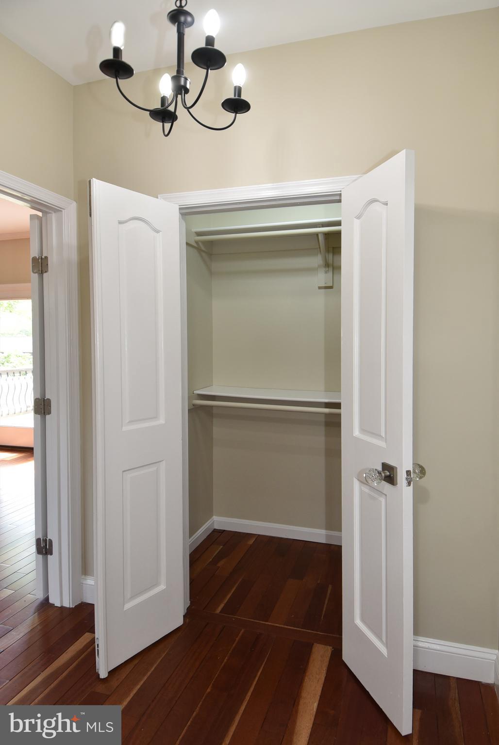 1805 Glenarm Road Edgewater, MD 21037 - Photo 38 of 59 PRIMARY BEDROOM CLOSET 1 & CHANDELIER
