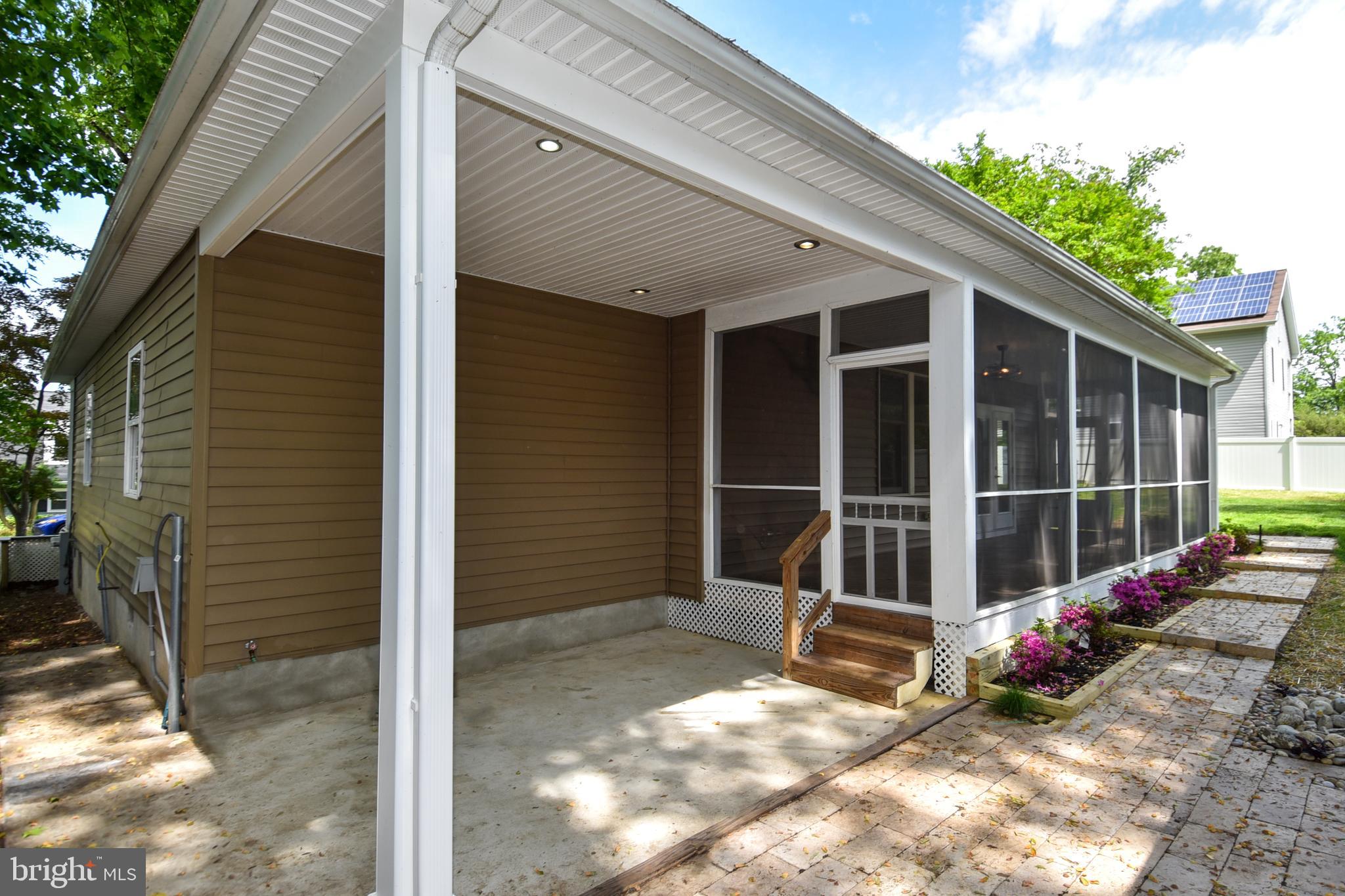 1805 Glenarm Road Edgewater, MD 21037 - Photo 49 of 59 EXTERIOR REAR SCREENED IN PORCH AND PATIO