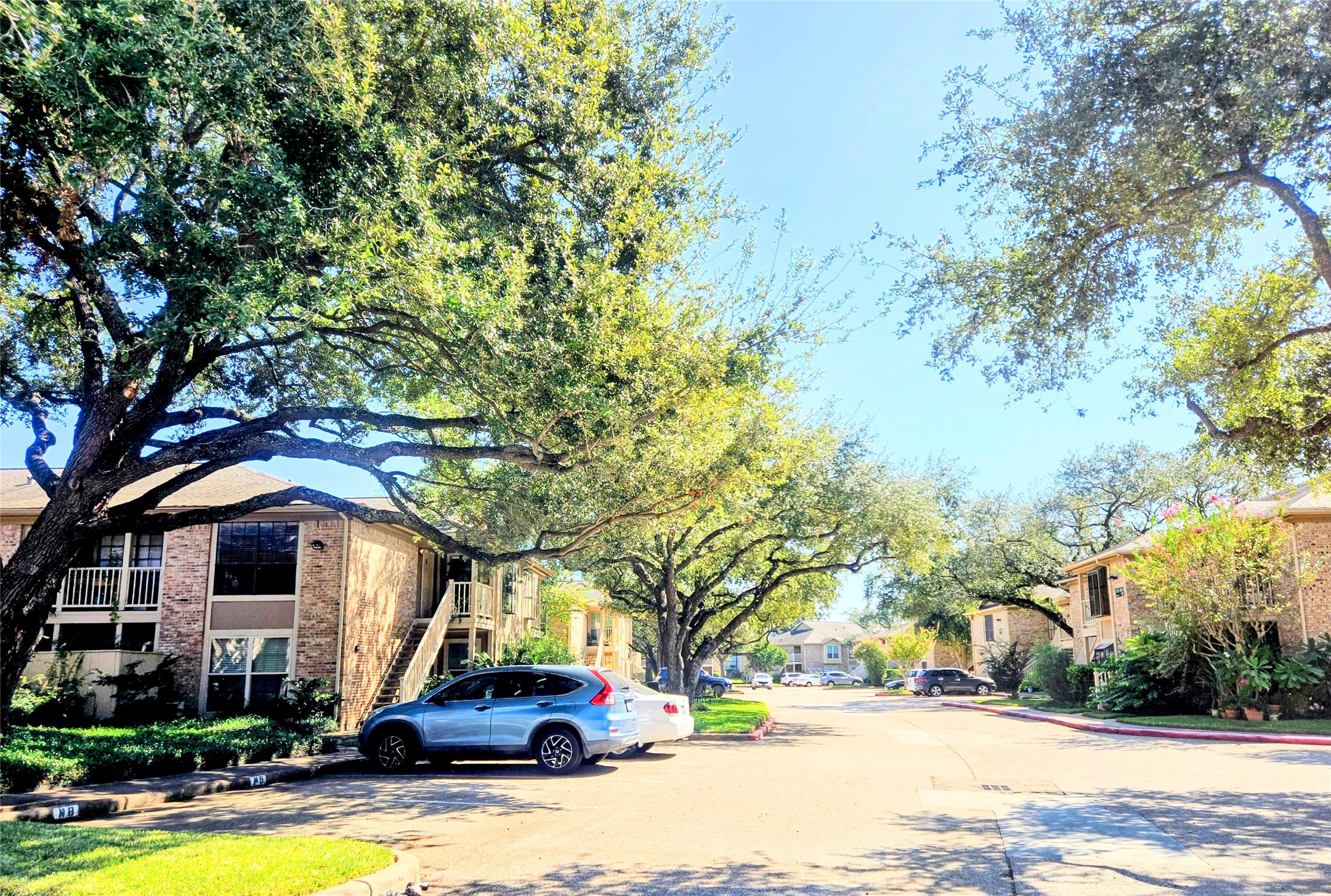1311 Antoine Drive, Unit 252 Houston, TX 77055 - Photo 4 of 22 a front view of a house with a yard
