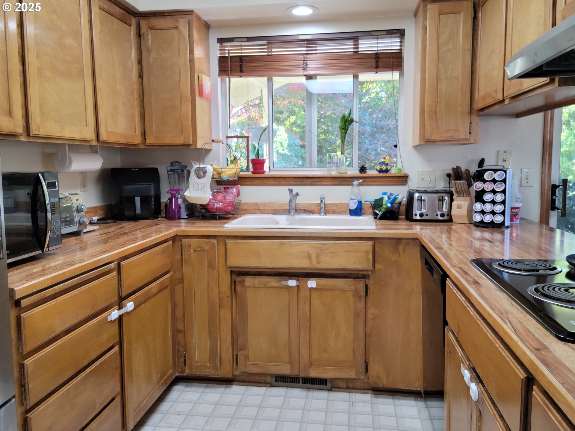 1523 Northwest Thompson Way Grants Pass, OR 97526 - Photo 16 of 39 a kitchen with a sink cabinets and window