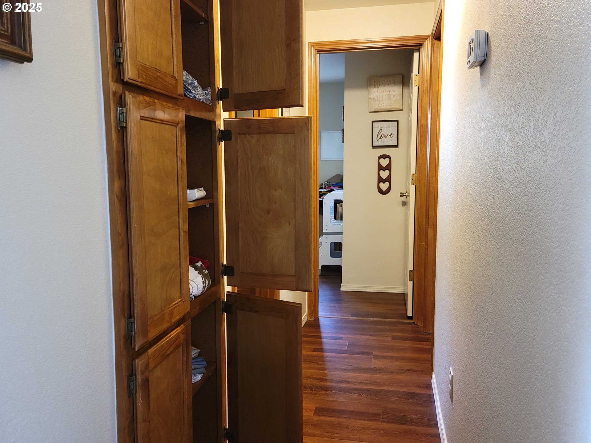 1523 Northwest Thompson Way Grants Pass, OR 97526 - Photo 17 of 39 a view of a hallway with wooden floor