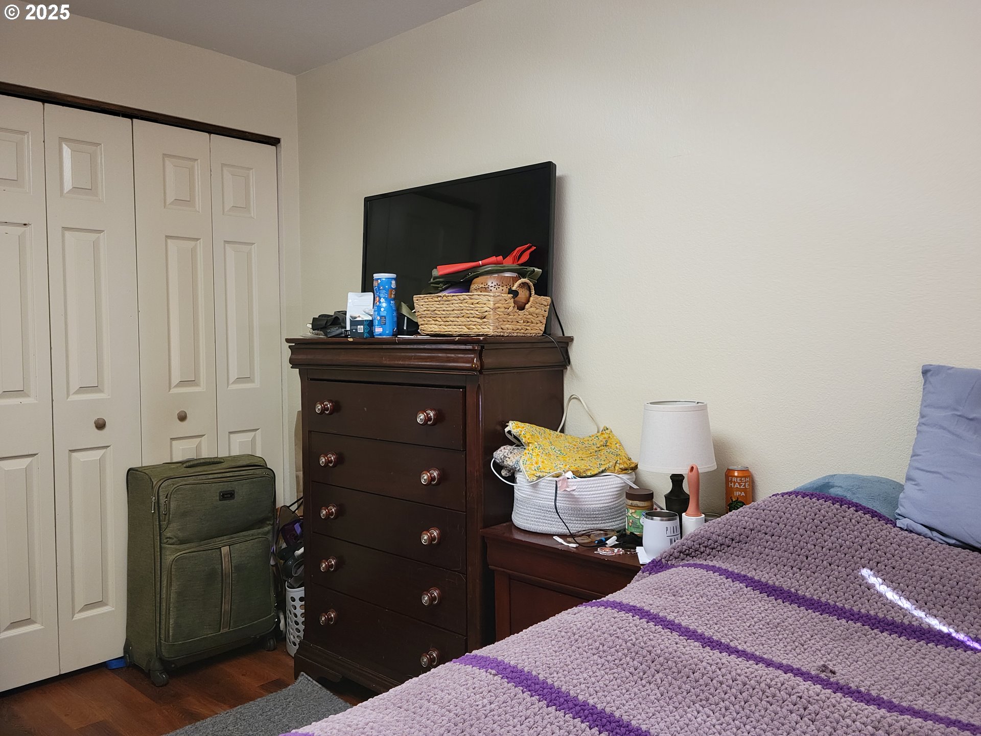 1523 Northwest Thompson Way Grants Pass, OR 97526 - Photo 19 of 39 a bedroom with a bed and wooden floor