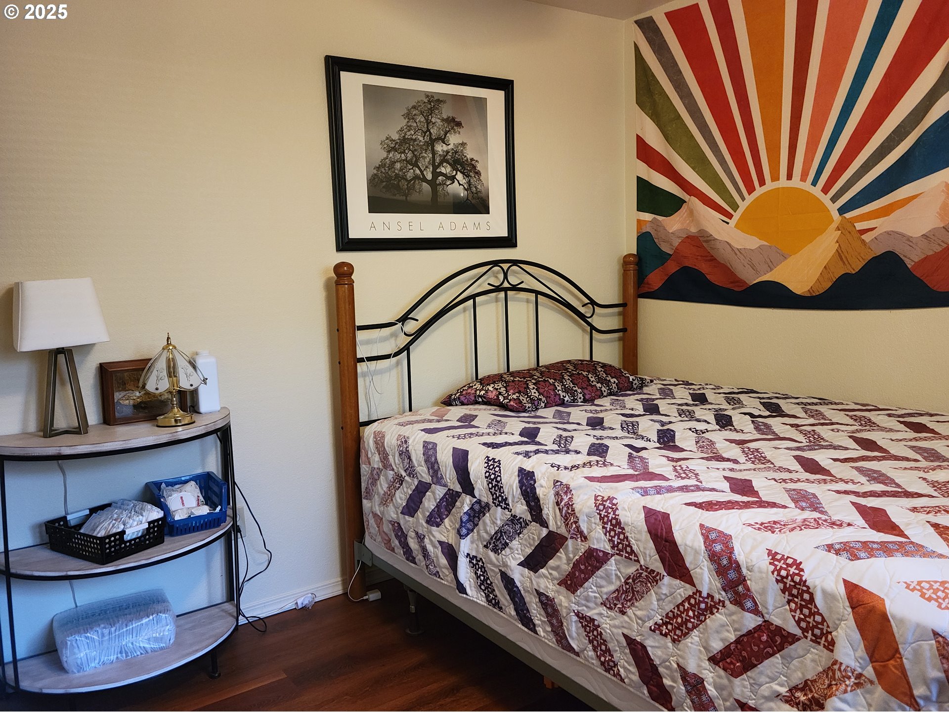 1523 Northwest Thompson Way Grants Pass, OR 97526 - Photo 21 of 39 a bedroom with a bed and a painting on the wall