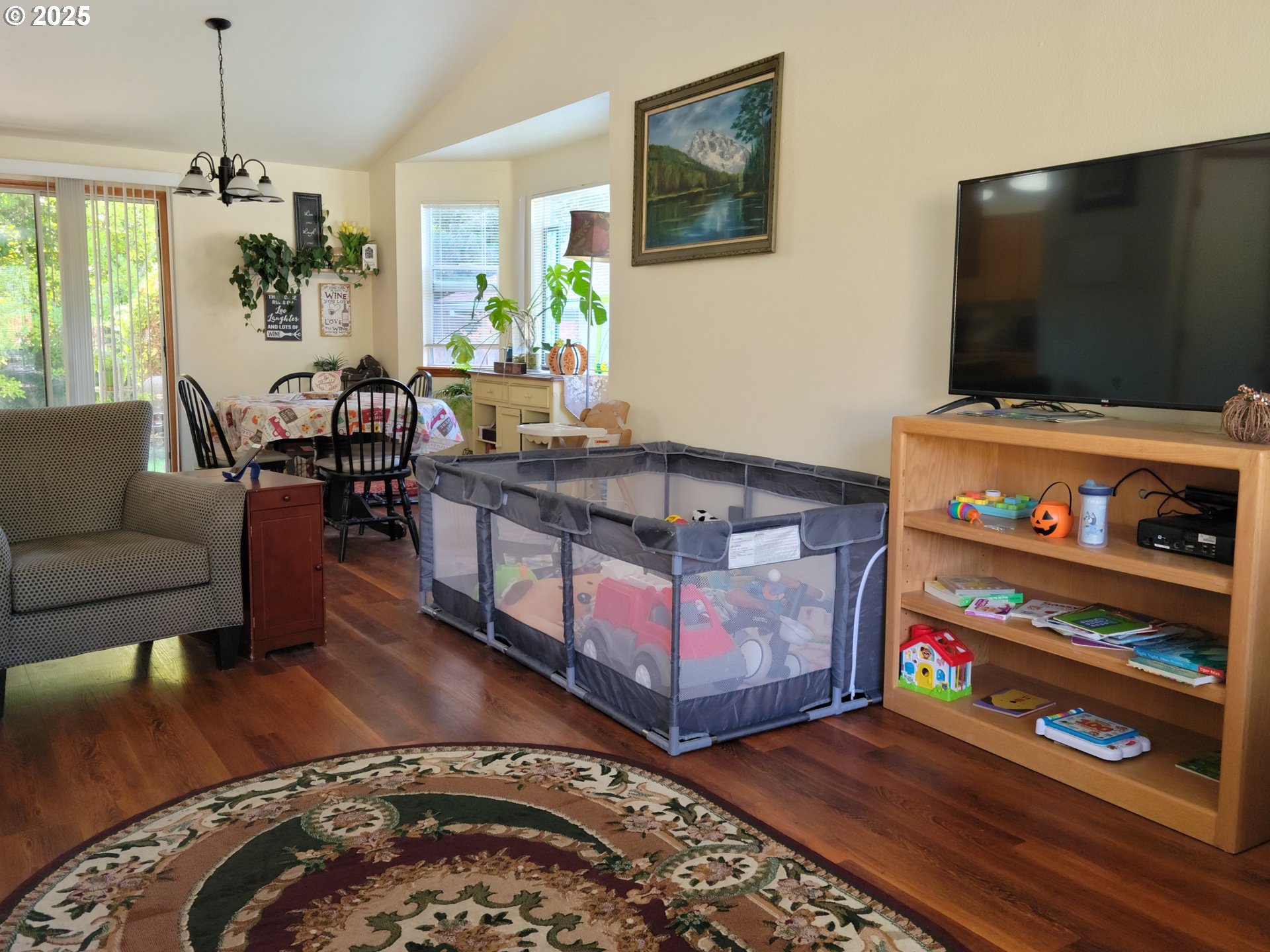 1523 Northwest Thompson Way Grants Pass, OR 97526 - Photo 5 of 39 a living room with furniture and a flat screen tv