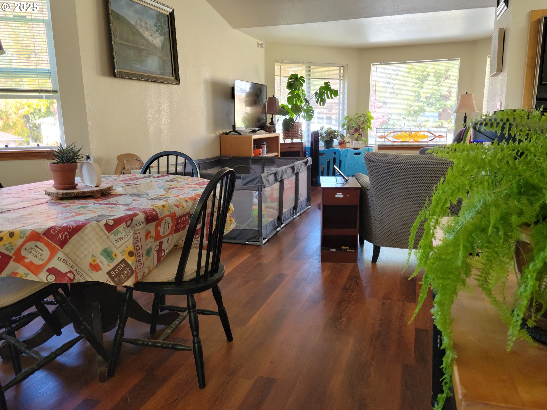 1523 Northwest Thompson Way Grants Pass, OR 97526 - Photo 8 of 39 a view of a dining room with furniture window and wooden floor
