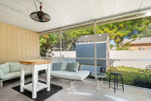 a outdoor space with patio the couches and a dining table with garden view