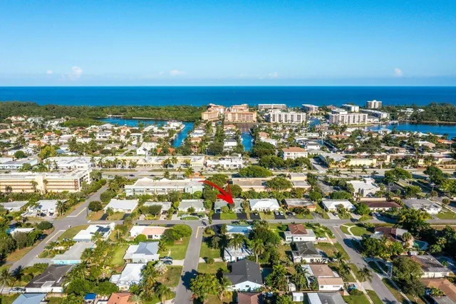 an aerial view of a house with a swimming pool