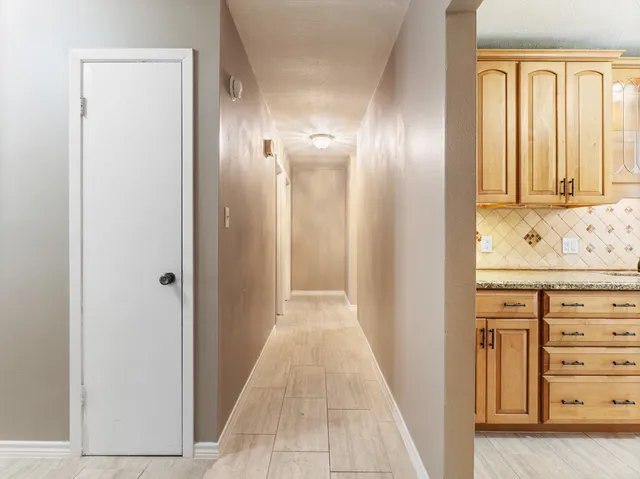 a view of a hallway with closet