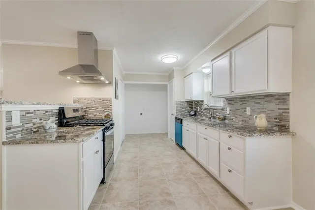 a kitchen with stainless steel appliances granite countertop a sink stove and cabinets