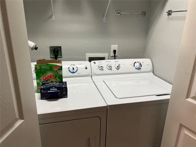 a utility room with dryer and washer