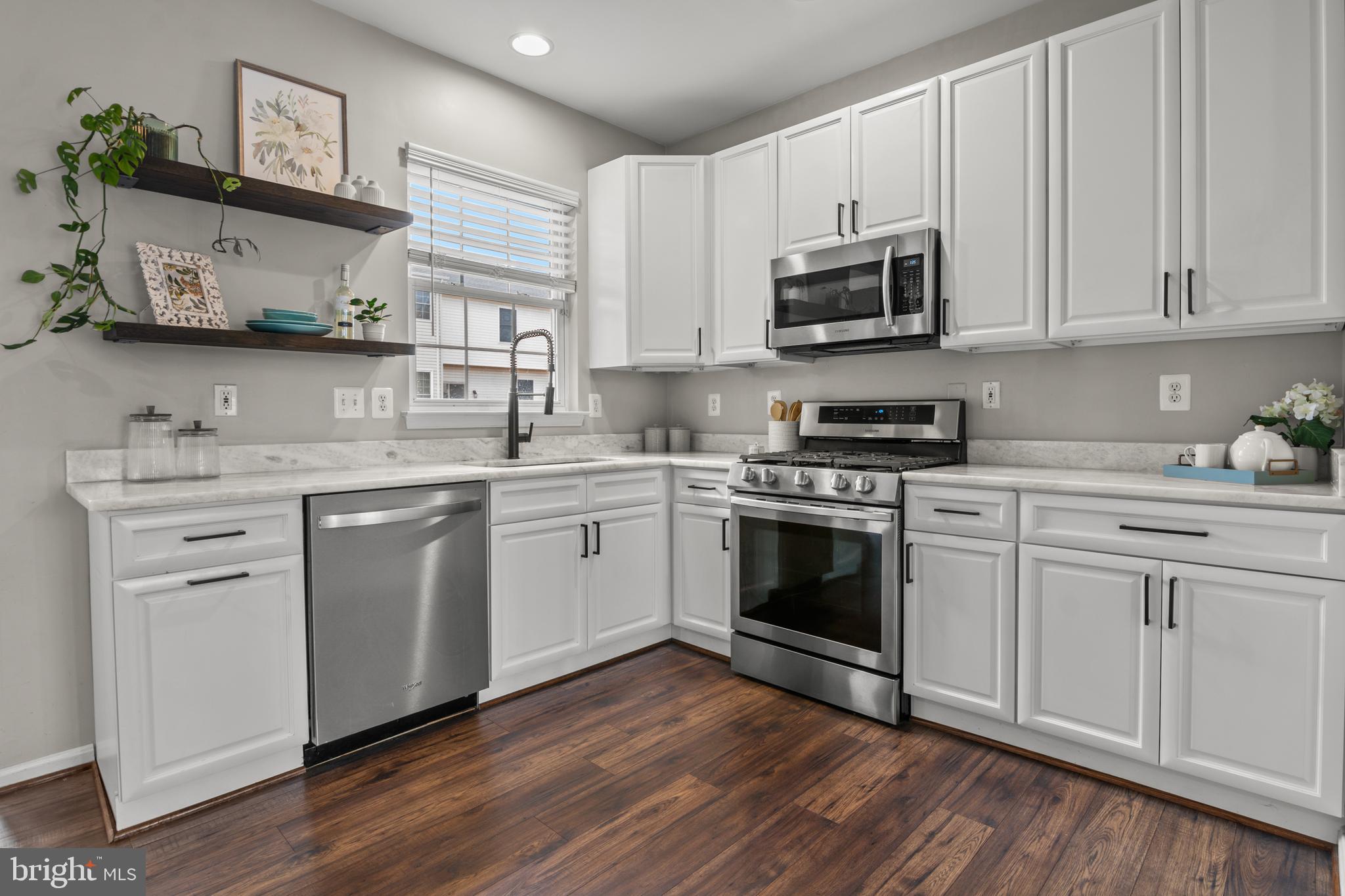 1010 Carbondale Way Crofton, MD 21114 - Photo 26 of 65 a kitchen with white cabinets stainless steel appliances and sink