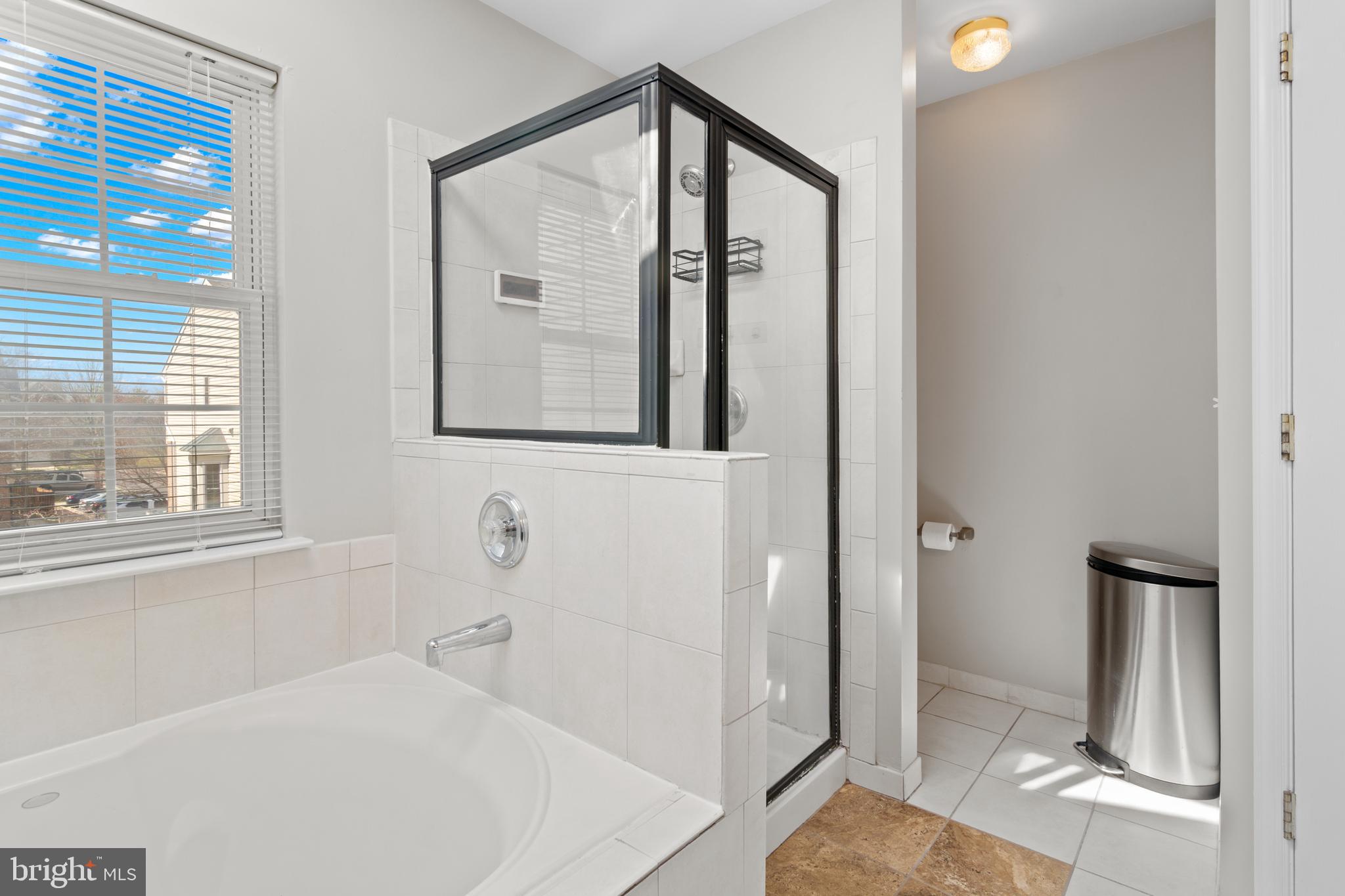 1010 Carbondale Way Crofton, MD 21114 - Photo 48 of 65 a bathroom with a bathtub and a shower