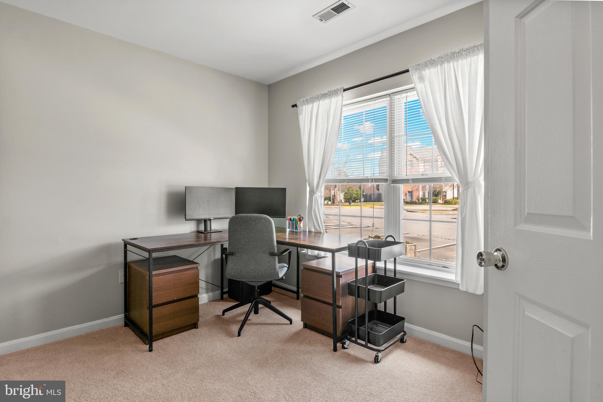 1010 Carbondale Way Crofton, MD 21114 - Photo 5 of 65 a view of a workspace with furniture and a window