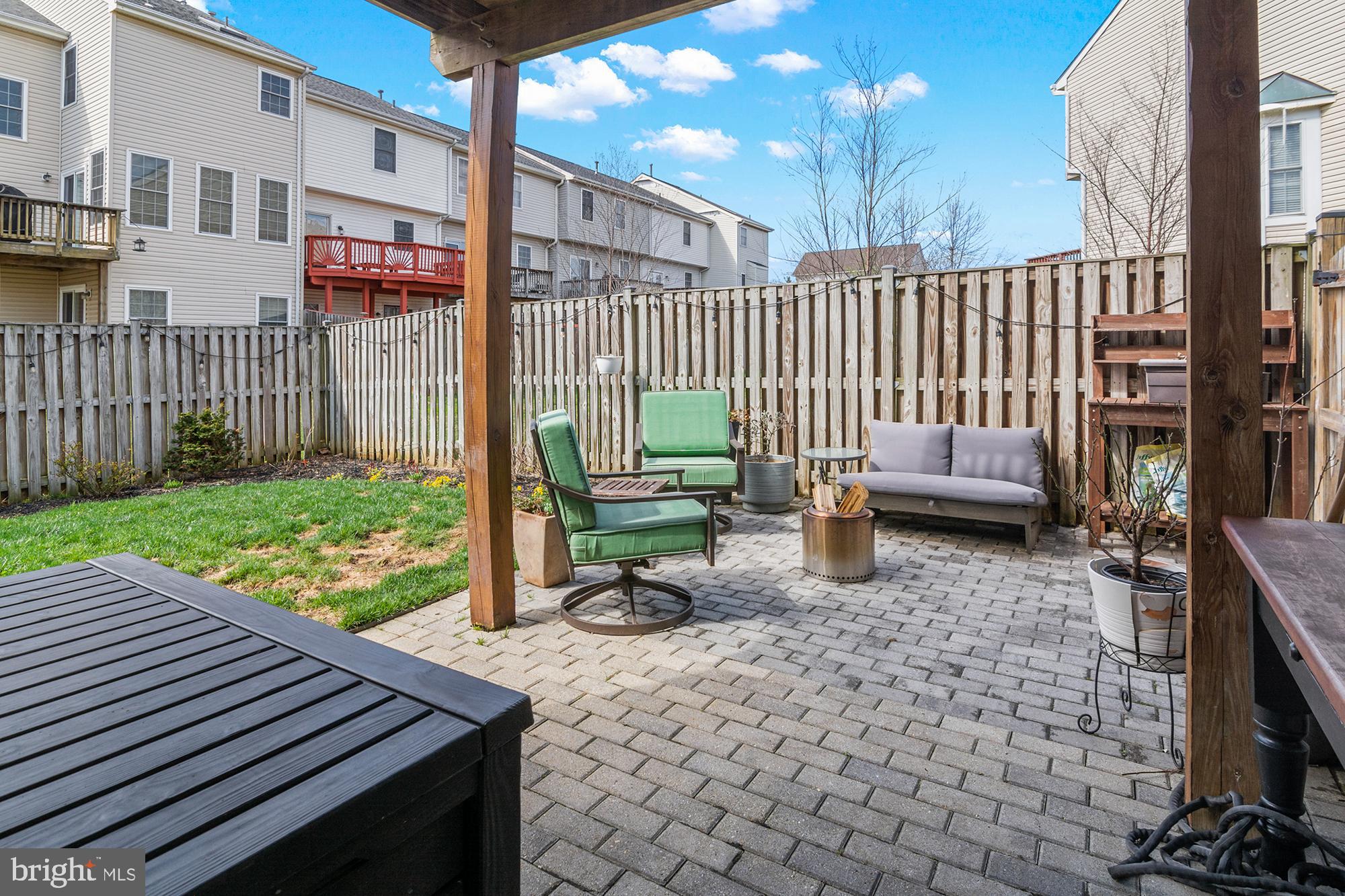 1010 Carbondale Way Crofton, MD 21114 - Photo 57 of 65 a view of a patio with a table and chairs with wooden fence