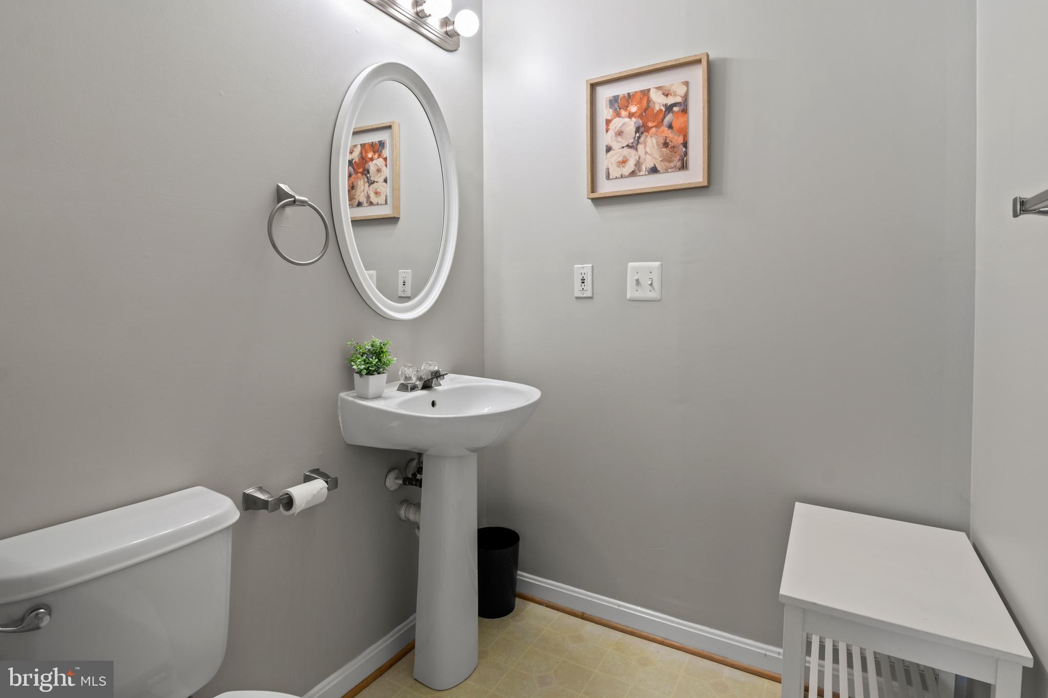 1010 Carbondale Way Crofton, MD 21114 - Photo 8 of 65 a bathroom with a sink mirror and toilet