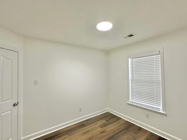 a view of a room that has a window in it
