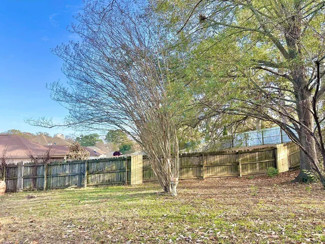 a house with swimming pool in front of it