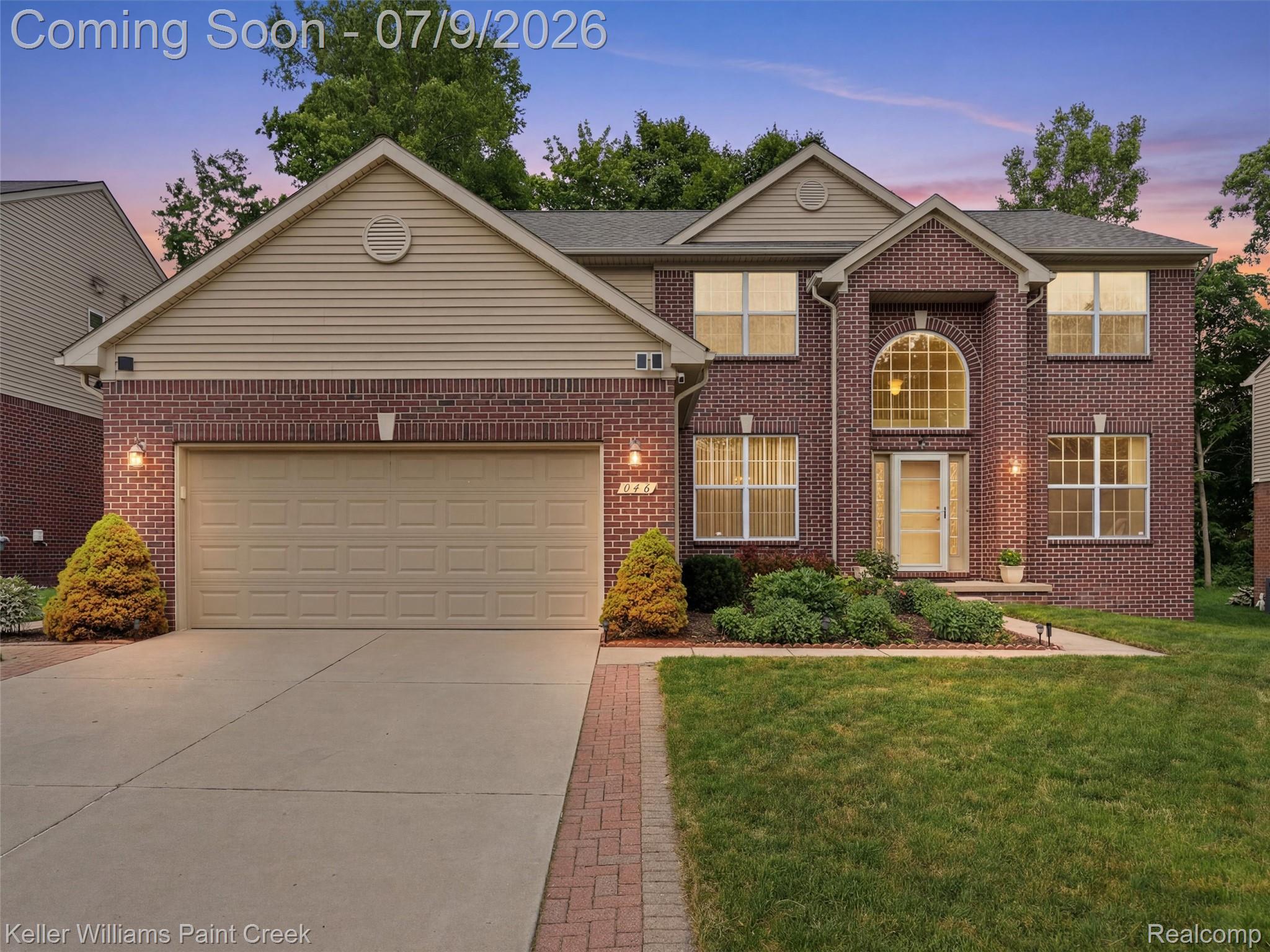 846 Monterey Ln. Rochester, MI 48307 - Photo 1 of 52 Brick and siding exterior featuring a prominent arched window above the entry