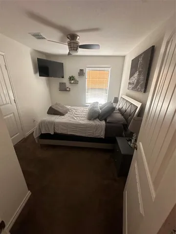 a bedroom with furniture and a window