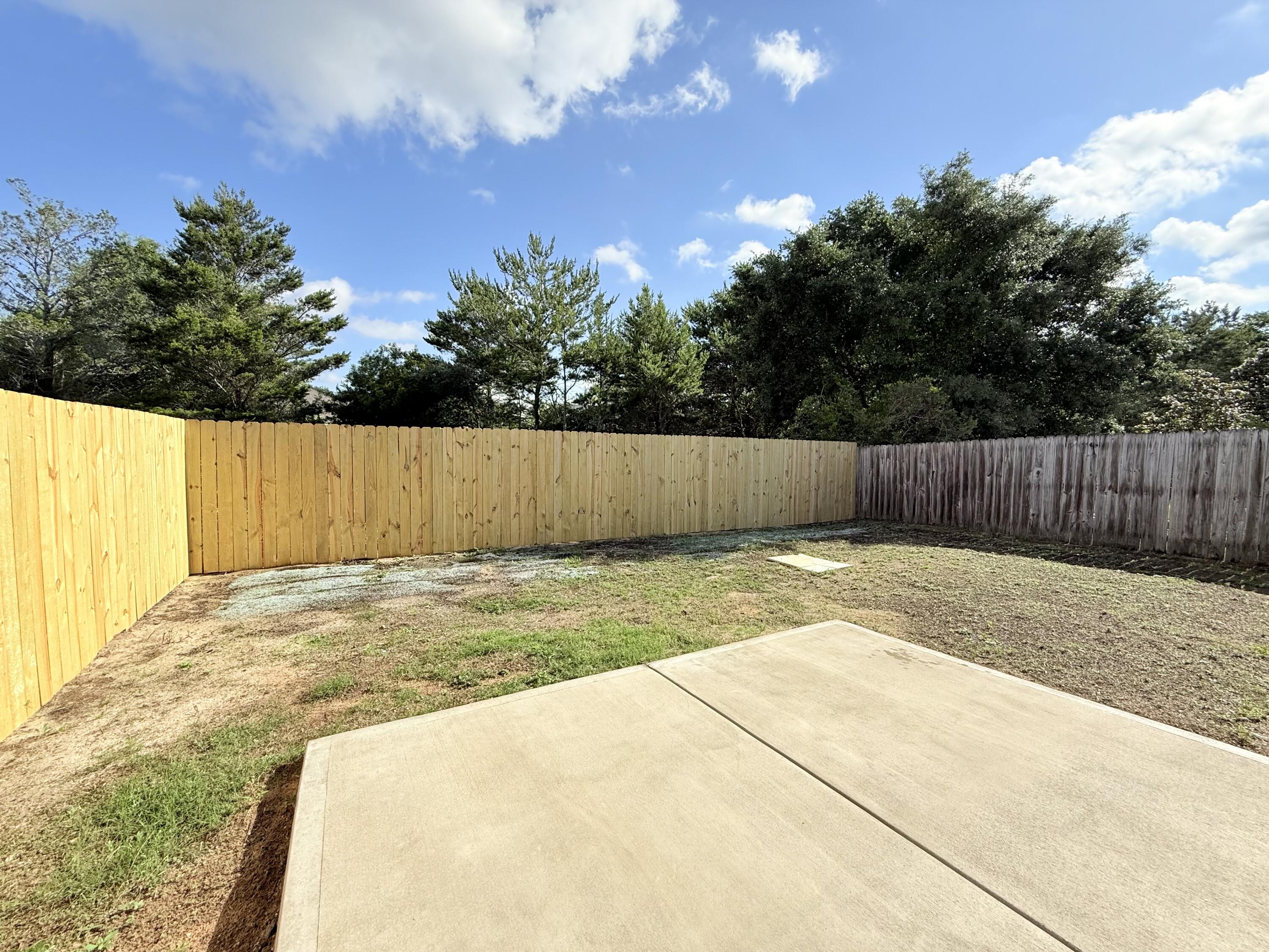 7612 Chablis Circle Navarre, FL 32566 - Photo 16 of 16 a view of back yard with wooden fence