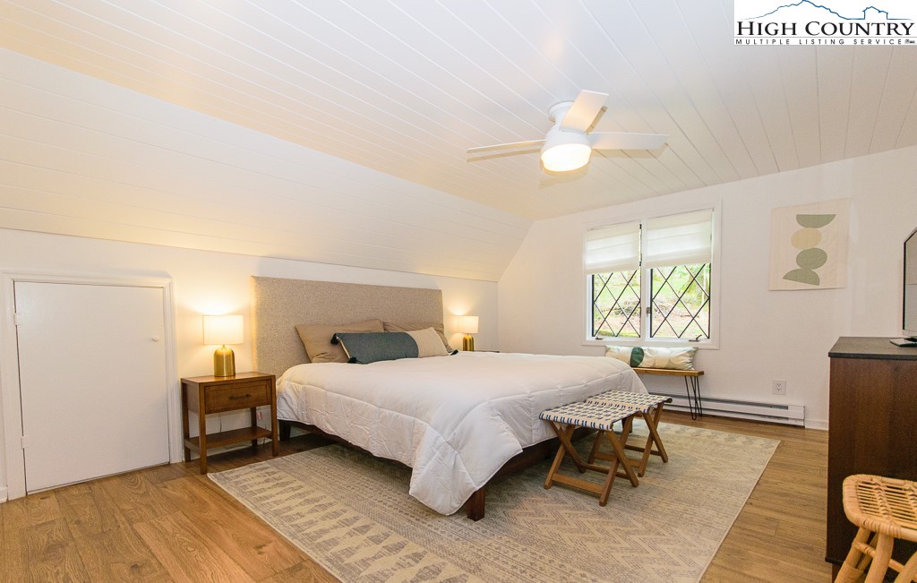 205 Spring Branch Road Beech Mountain, NC 28604 - Photo 20 of 46 a bedroom with a bed and a table