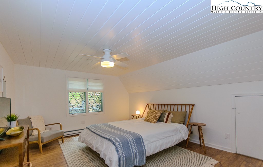 205 Spring Branch Road Beech Mountain, NC 28604 - Photo 24 of 46 a bedroom with a bed and a window