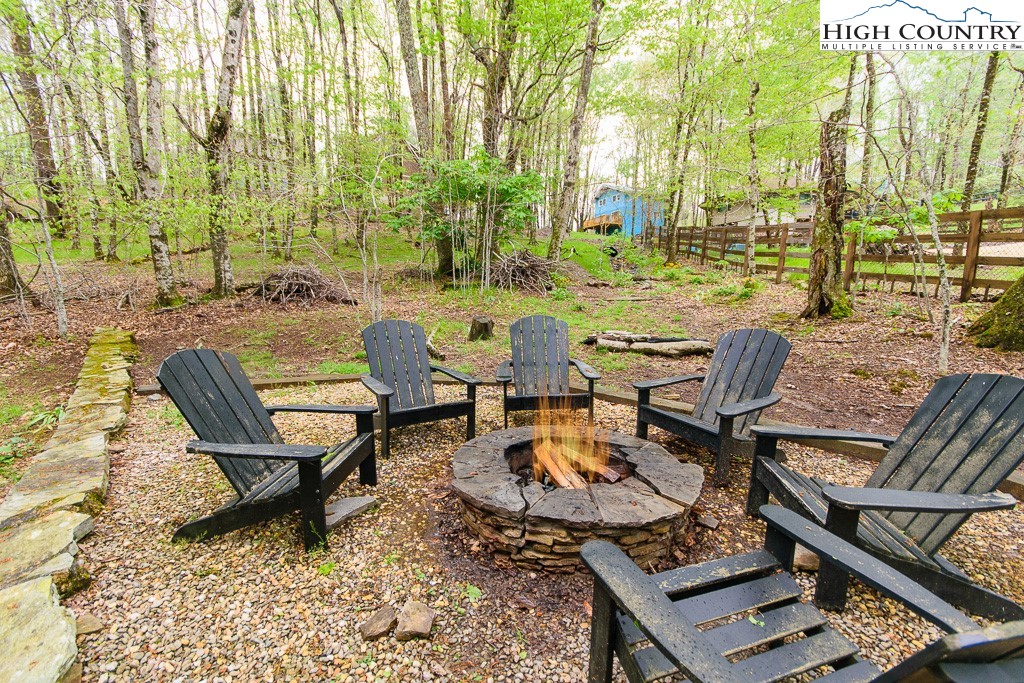 205 Spring Branch Road Beech Mountain, NC 28604 - Photo 37 of 46 a view of a patio with chairs and table