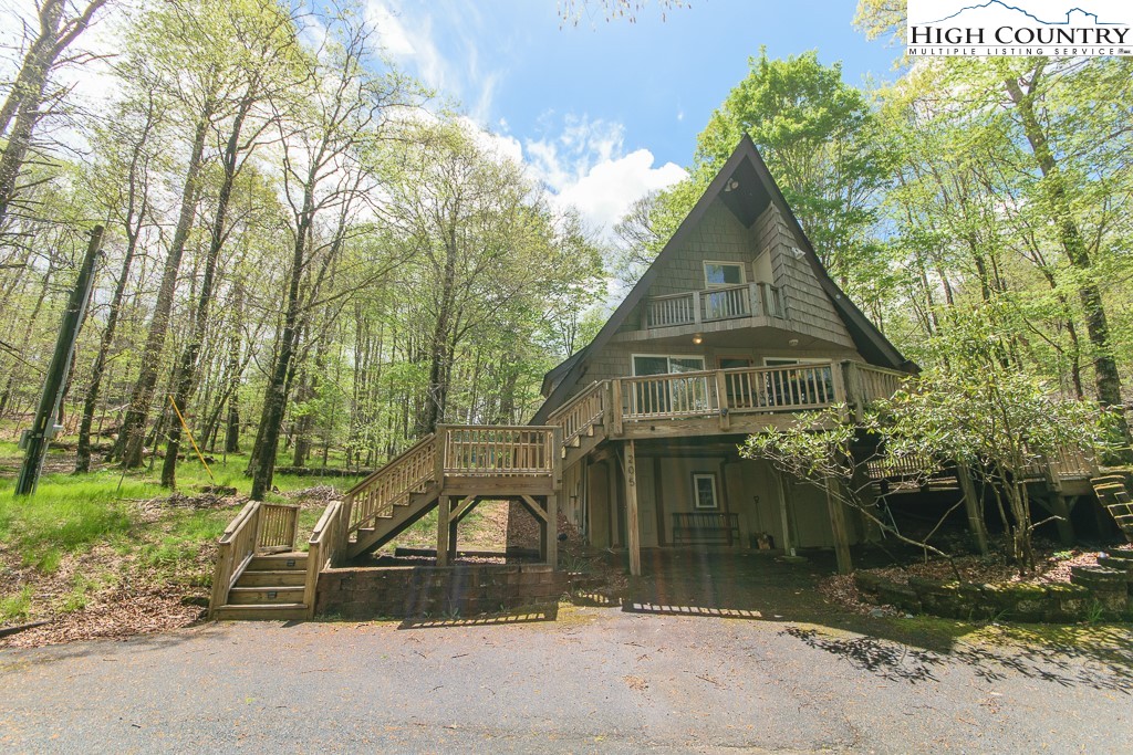 205 Spring Branch Road Beech Mountain, NC 28604 - Photo 40 of 46 a view of a house with a yard
