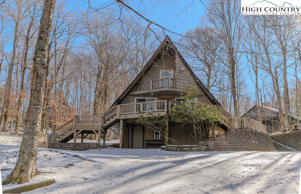 205 Spring Branch Road Beech Mountain, NC 28604 - Photo 46 of 46 a view of a house with a yard