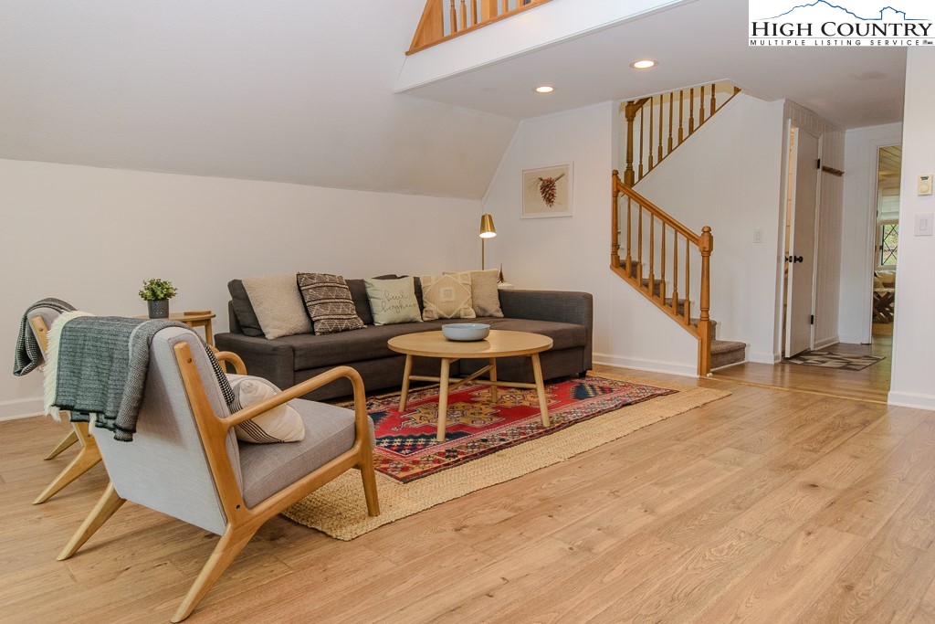 205 Spring Branch Road Beech Mountain, NC 28604 - Photo 8 of 46 a living room with furniture and a wooden floor