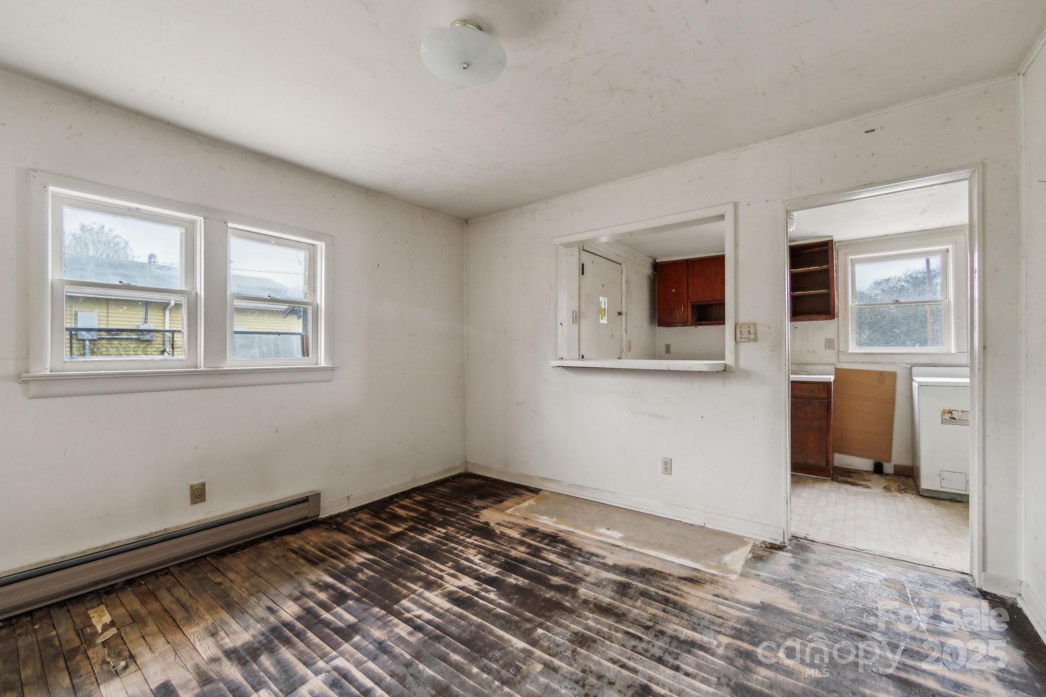 364 Browning Road Waynesville, NC 28786 - Photo 14 of 29 a view of a room with wooden floor and windows