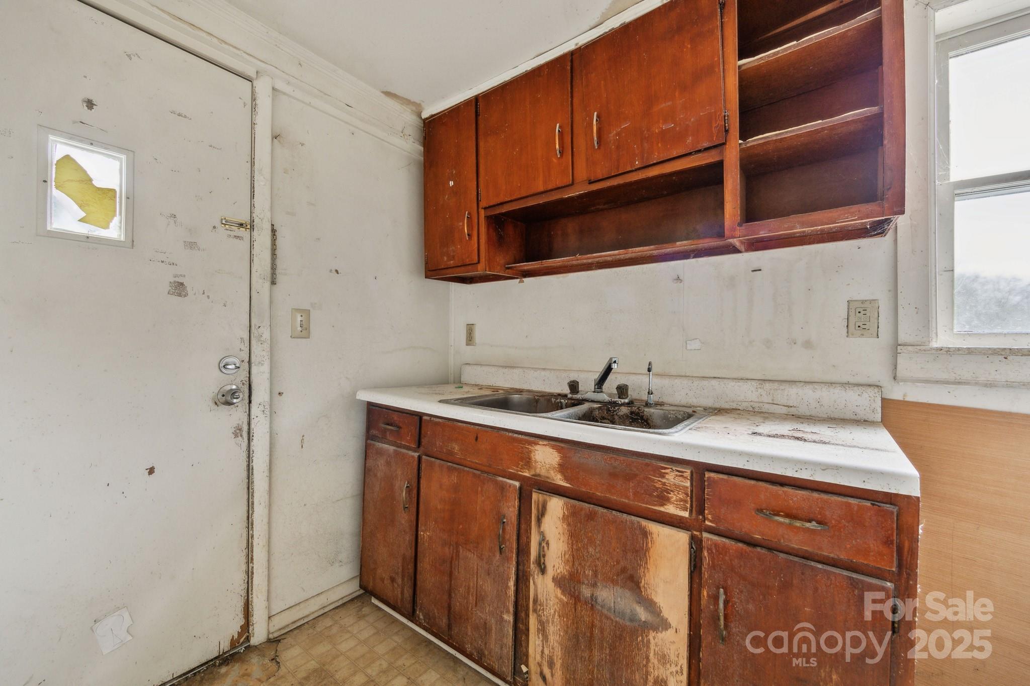 364 Browning Road Waynesville, NC 28786 - Photo 16 of 29 a kitchen with a sink and a cabinets