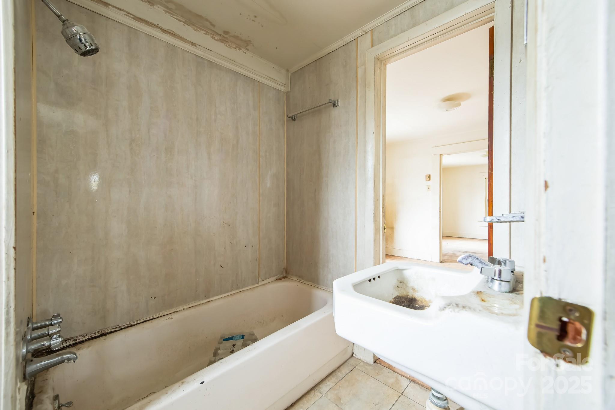 364 Browning Road Waynesville, NC 28786 - Photo 21 of 29 a bathroom with a tub sink and mirror