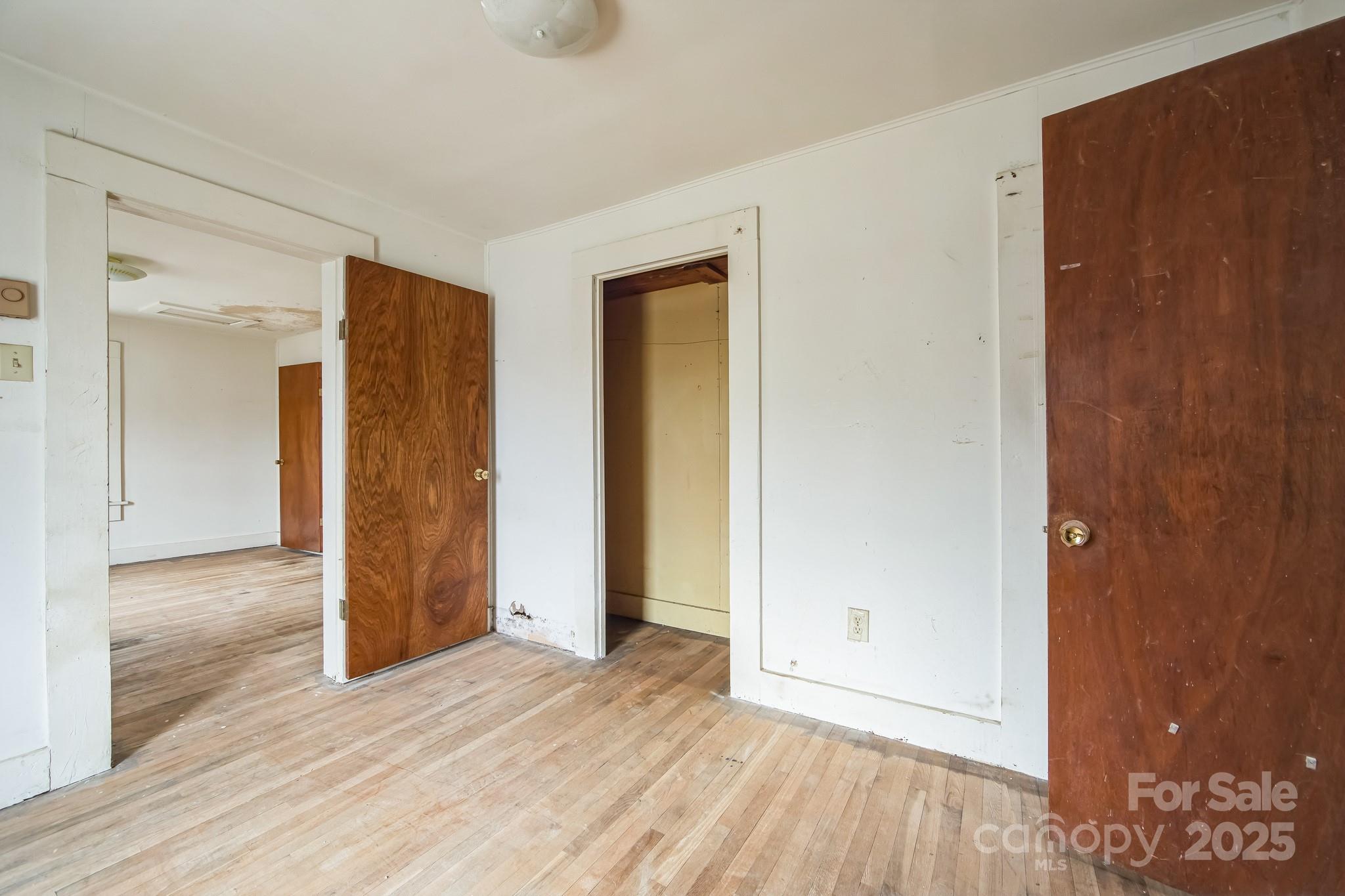 364 Browning Road Waynesville, NC 28786 - Photo 22 of 29 a view of an empty room with wooden floor and closet