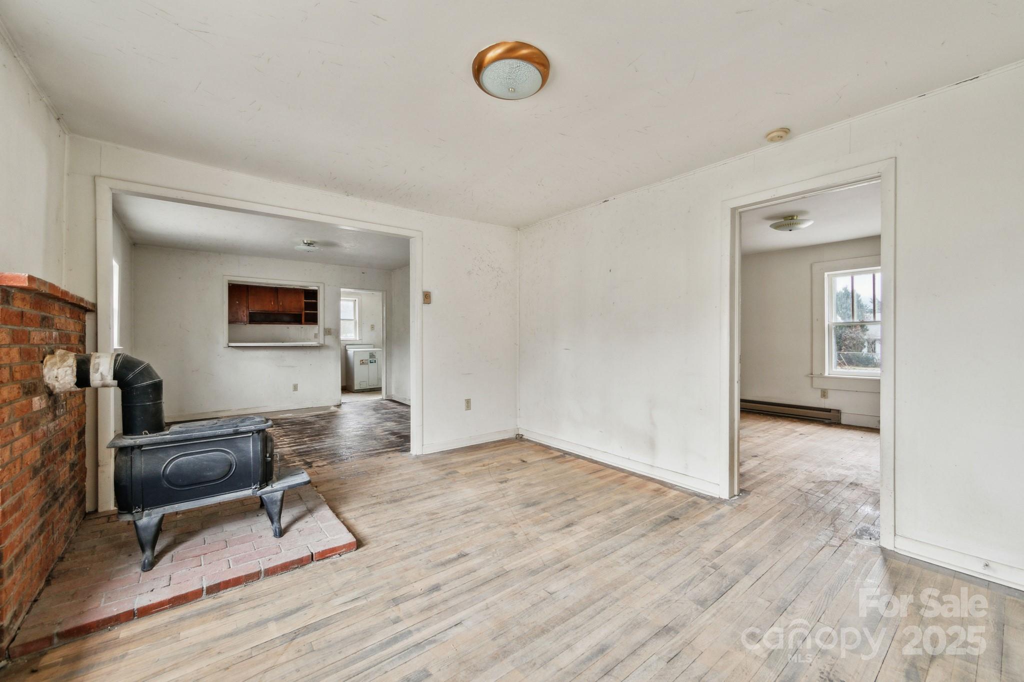 364 Browning Road Waynesville, NC 28786 - Photo 7 of 29 a view of a livingroom with wooden floor and furniture