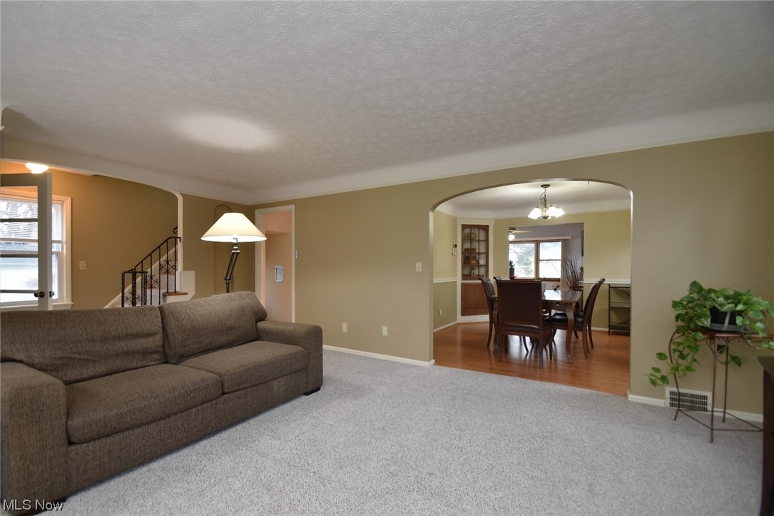 1521 Sheffield Road Cleveland, OH 44121 - Photo 6 of 29 Large living room leads to spacious dining room.