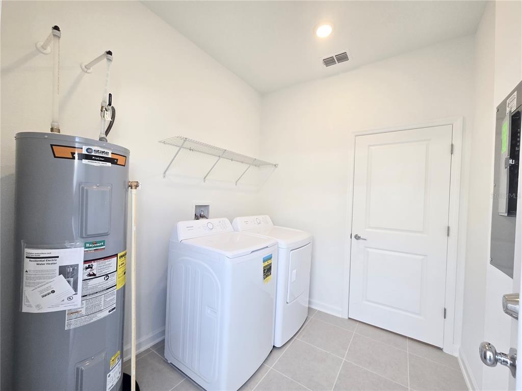2376 Rider Rain Lane Apopka, FL 32703 - Photo 11 of 27 a utility room with dryer and washer