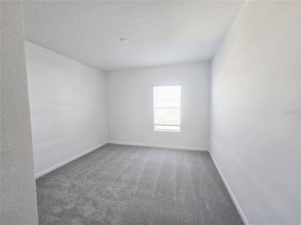 2376 Rider Rain Lane Apopka, FL 32703 - Photo 15 of 27 an empty room with a window