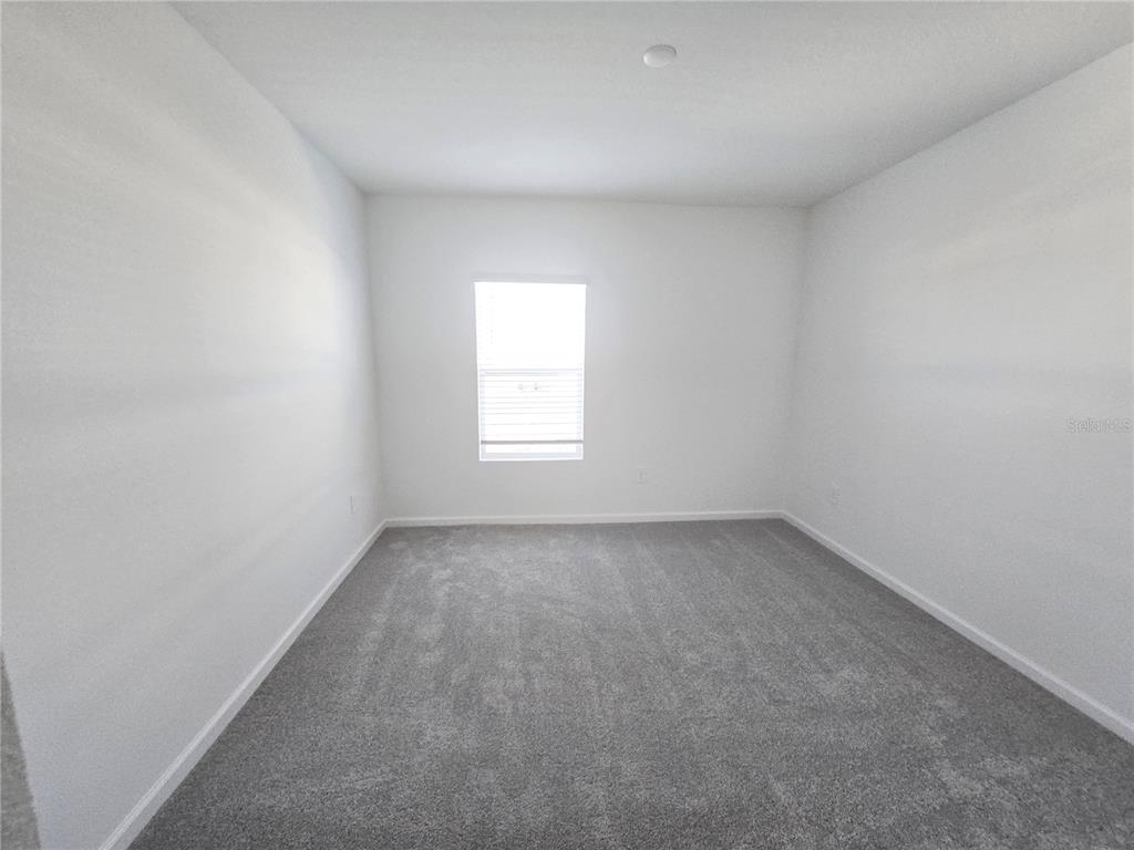 2376 Rider Rain Lane Apopka, FL 32703 - Photo 17 of 27 an empty room with a window
