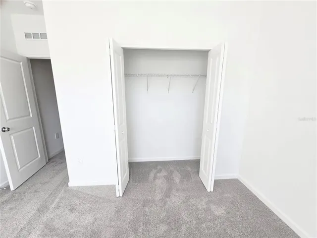 a bathroom with a sink a mirror and a window