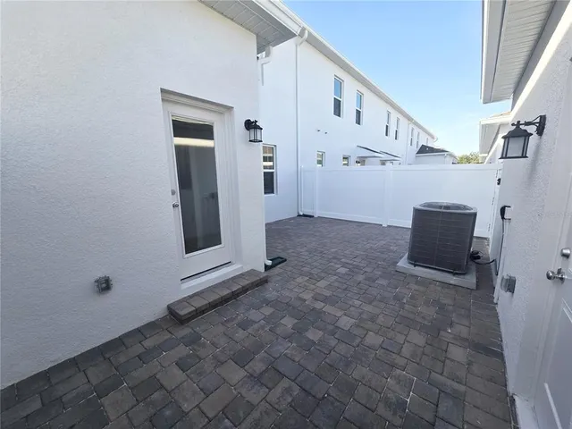 a view of an empty room with windows